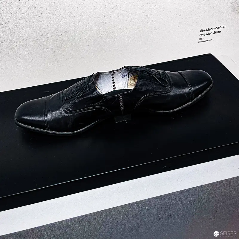 Black Leather Oxford Shoe on Minimalist Display Platform