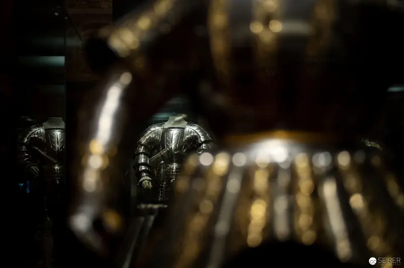 Armored Reflections: Mechanical Figures in Shadowy Metallic Landscape