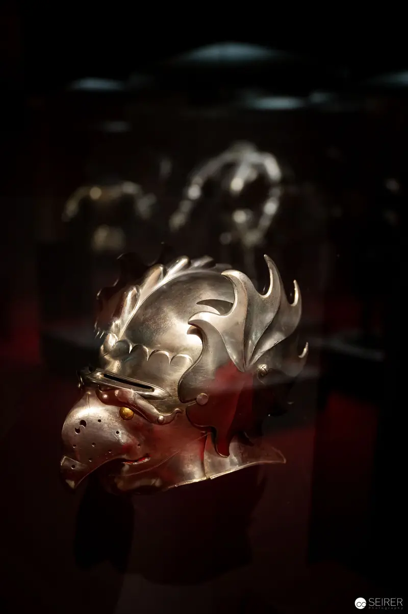 Intricately Sculpted Metallic Helmet with Ornate Antler-like Embellishments