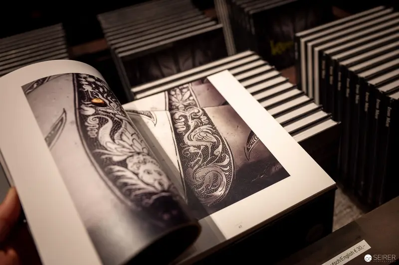 Intricate Tattoo Design Book Displayed in Monochromatic Archival Setting