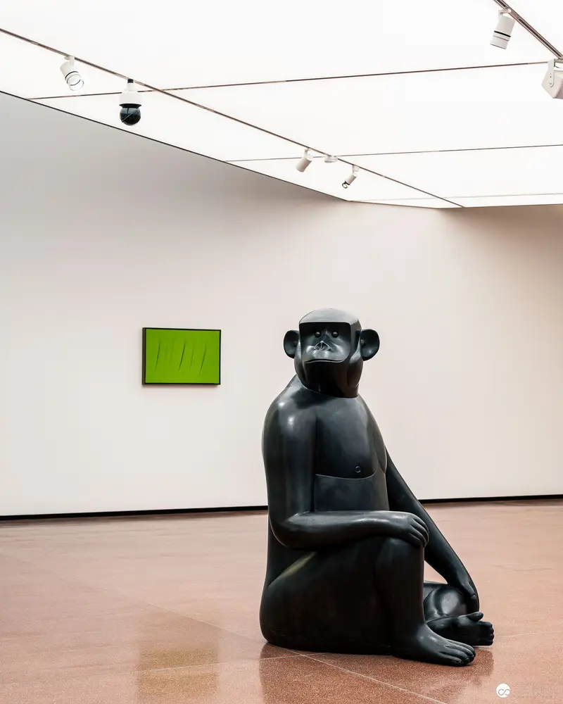 Black Sculptural Monkey Figure in Minimalist Gallery Space at Heidi Horten Collection