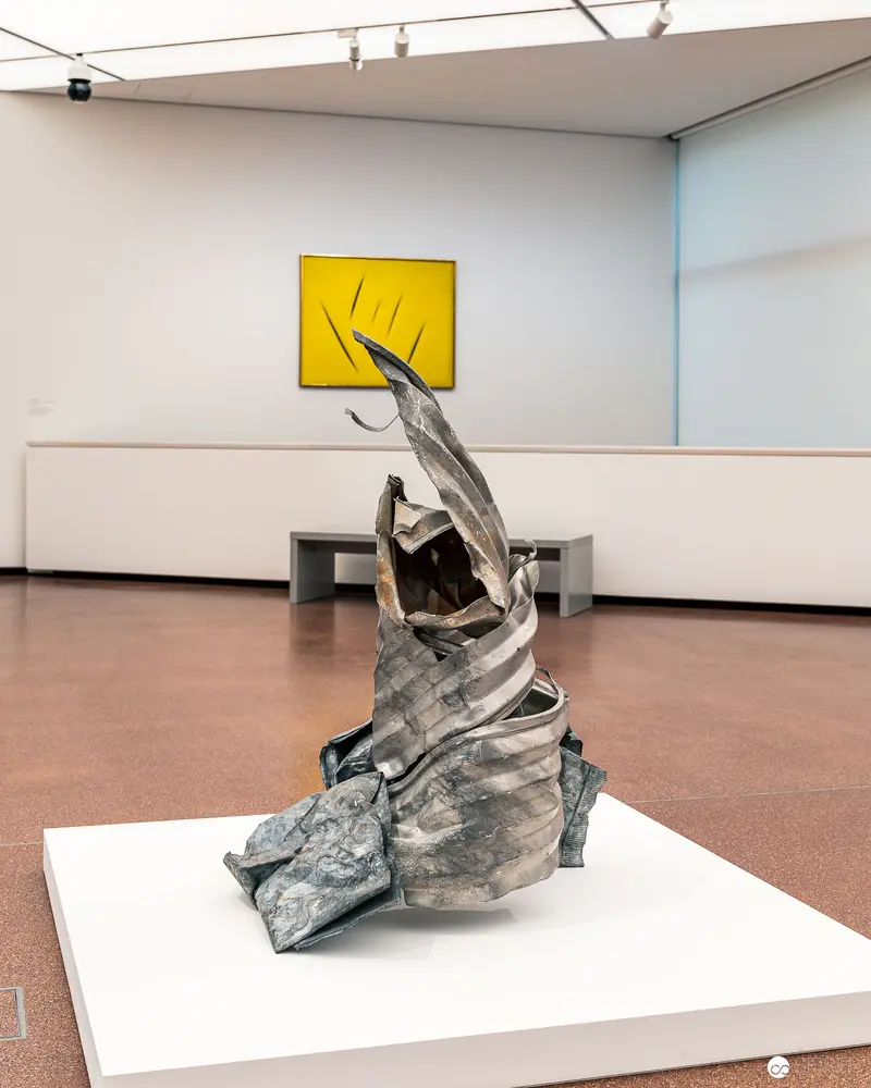 Twisted Metallic Sculpture on White Pedestal in Heidi Horten Collection Exhibition