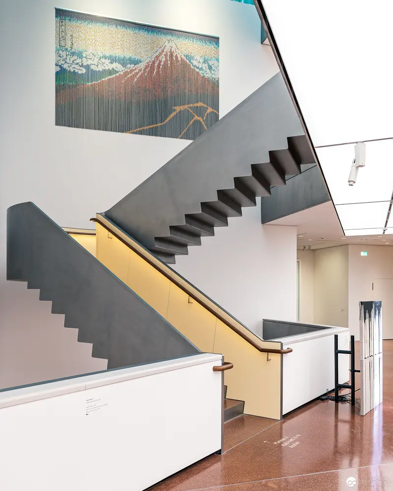 Modernist Interior with Japanese Art and Geometric Staircase Design