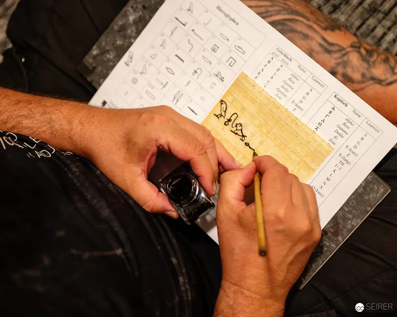 Papyrusmuseum Researcher Carefully Transcribing Ancient Document in Vienna