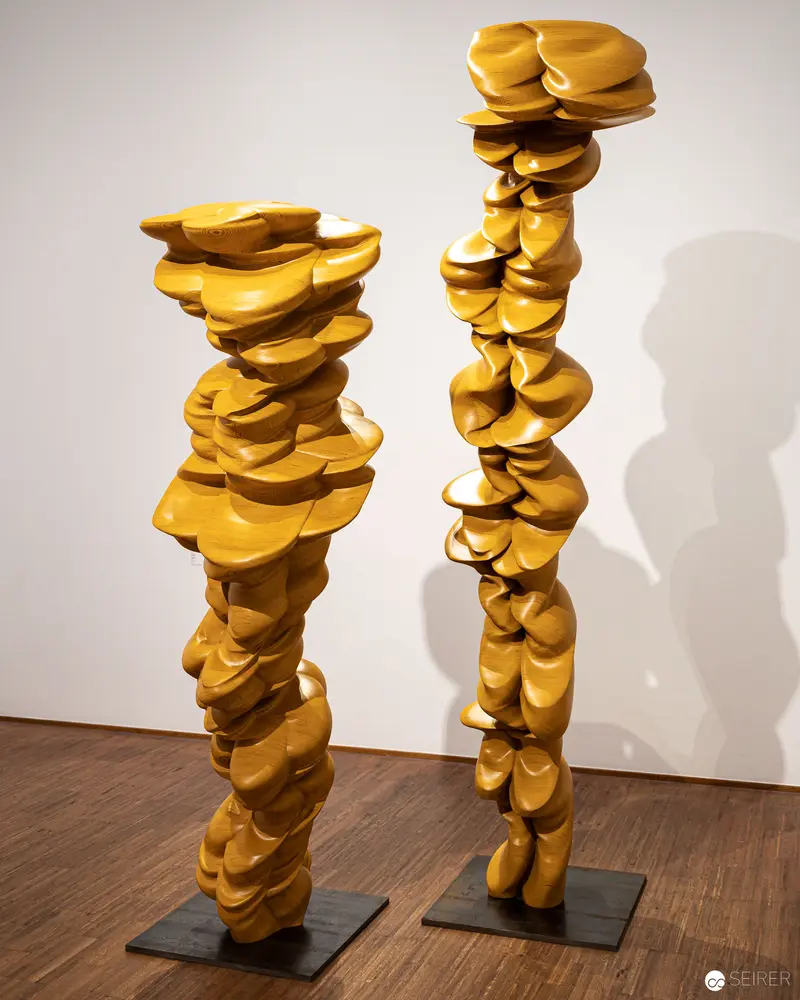 Tony Cragg Sculptural Stacks in Mustard Yellow at Albertina Exhibition