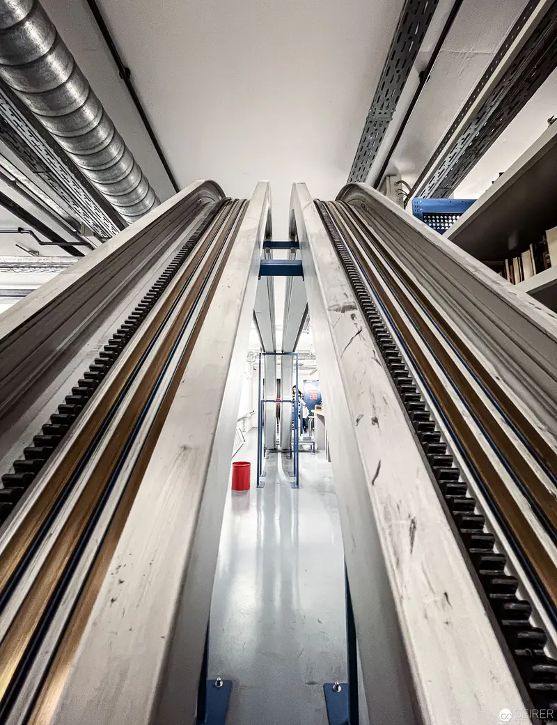 Symmetrical Architectural Perspective of Escalators in Modern Corridor