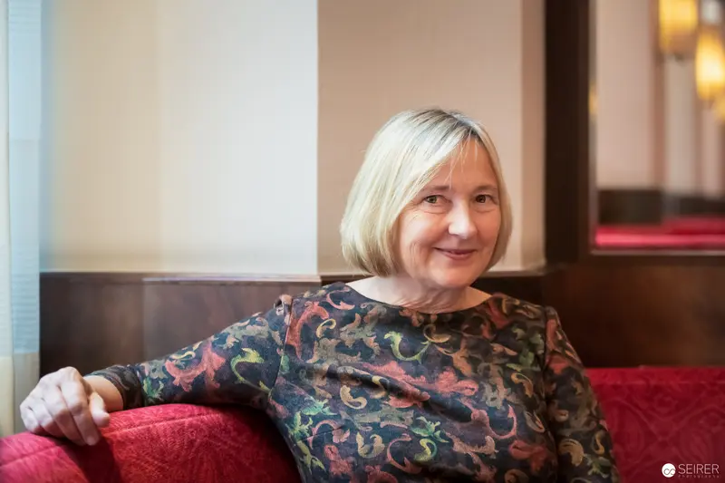 Ute Krause in Reflective Pose during Interview with Janett Cernohuby