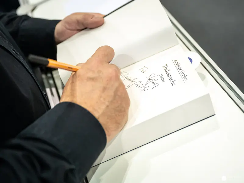 Hand Writing Notes with Pencil at Buch Wien 2022 Publishing Event