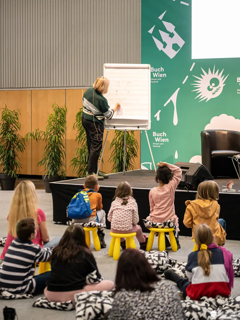 Buch Wien 2022: Children Engaged in Interactive Reading Workshop