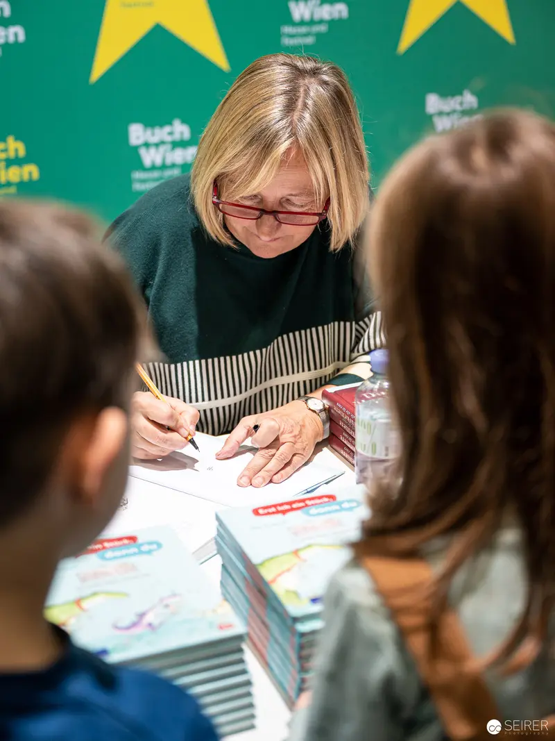 Book Signing at Buch Wien 2022: Author Engaging with Readers