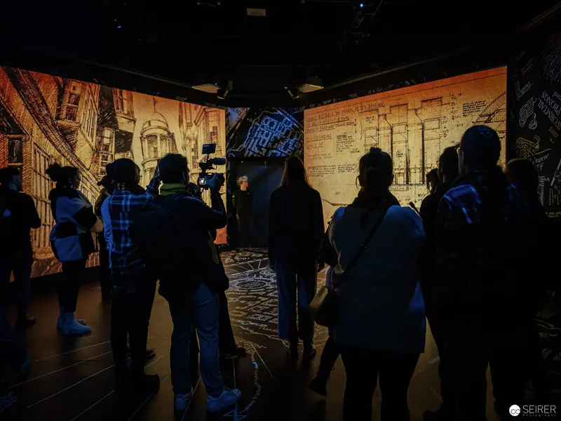 Visitors Exploring Architectural Displays at Harry Potter Exhibition in Vienna