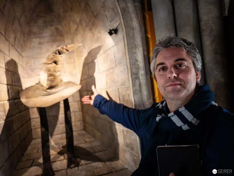 Curator Presenting Artifact at Harry Potter Exhibition, Vienna
