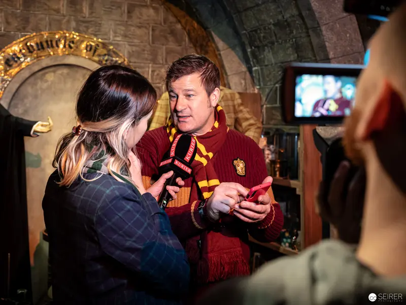 Harry Potter Exhibition Interview at Vienna Museum with Gryffindor-Attired Staff Member