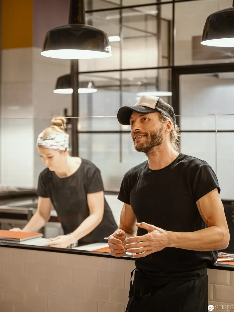 Zuckerlwerkstatt Wien: Artisan Craftspeople Preparing in Modern Kitchen Workshop