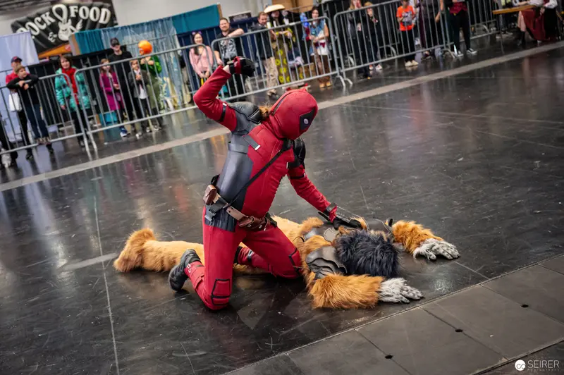 Deadpool Cosplayer Grappling with Furry Character at Vienna ComicCon 2022