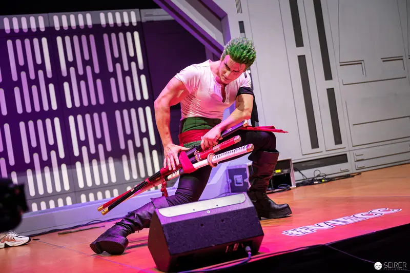 Zoro Cosplayer Performs Dynamic Sword Pose at Vienna ComicCon 2022 Championship