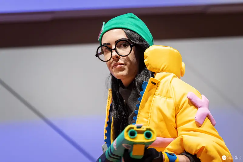 Cosplay Central Crown Championship Contestant in Vibrant Yellow and Green Ensemble