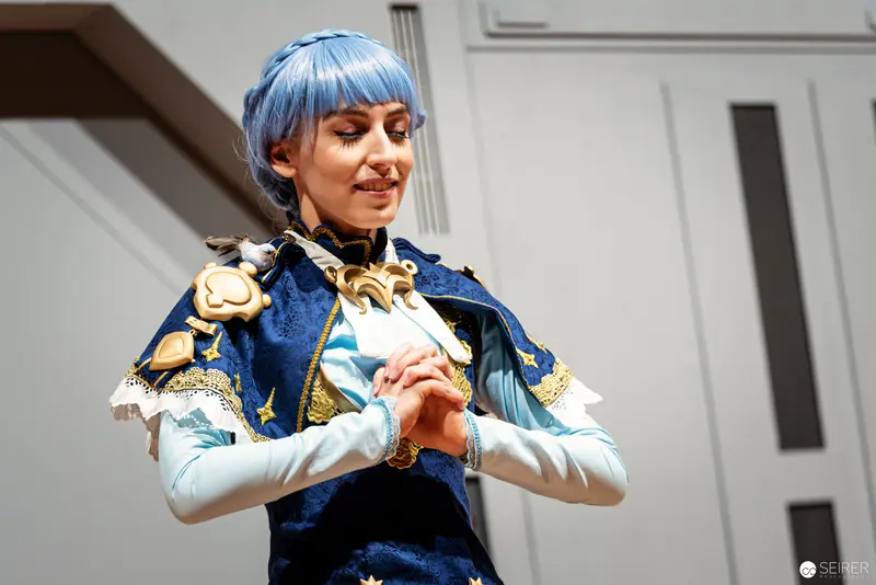 Blue-Haired Cosplayer in Ornate Costume at Vienna ComicCon 2022 Championship
