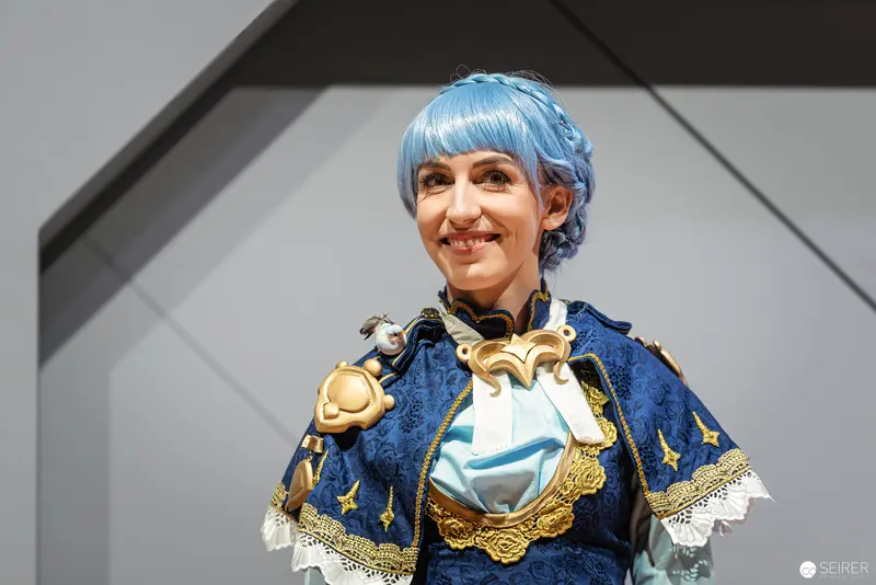 Blue-Haired Cosplayer in Ornate Historical Costume at Vienna ComicCon 2022