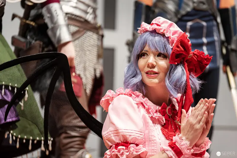 Cosplay Central Crown Championship Contestant in Frilly Pink and Red Costume