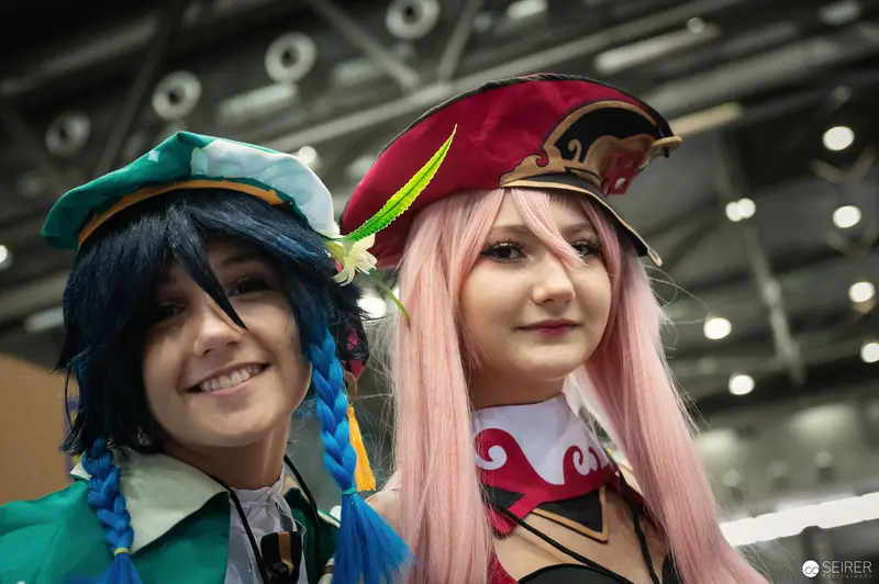 Cosplay Duo in Distinctive Headwear at Vienna ComicCon 2022