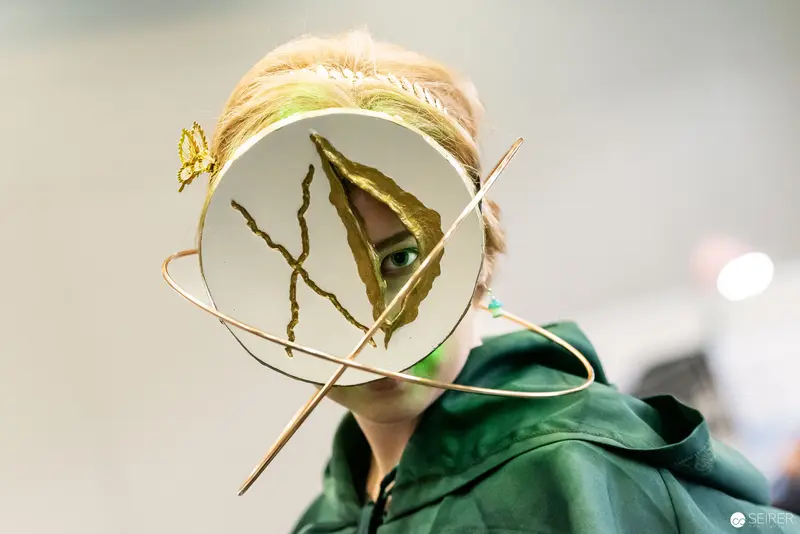 Cosplay Portrait with Butterfly and Circular Frame at Vienna ComicCon