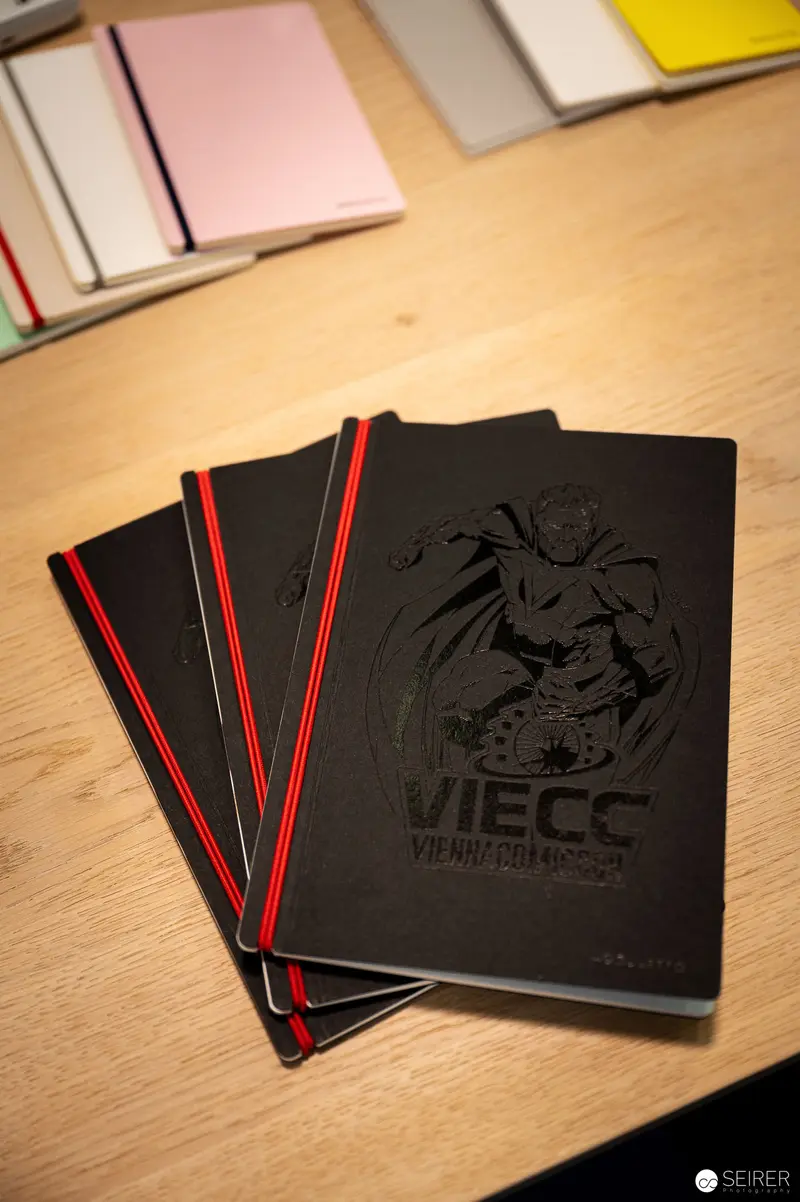 Vienna ComicCon Notebooks Showcasing Dark Graphic Design and Event Branding