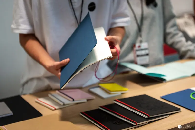 Archival Book Design Workshop with Colorful Notebooks and Lighting Technique