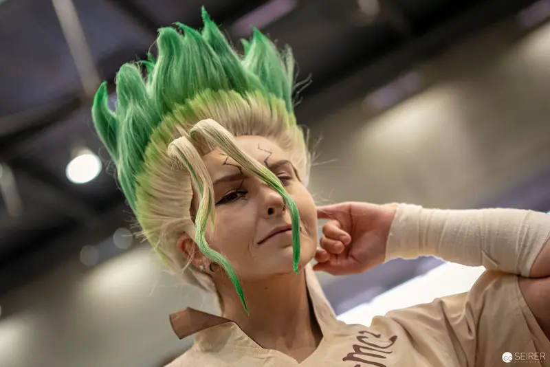 Green-Haired Cosplayer at Vienna ComicCon Striking Dramatic Pose