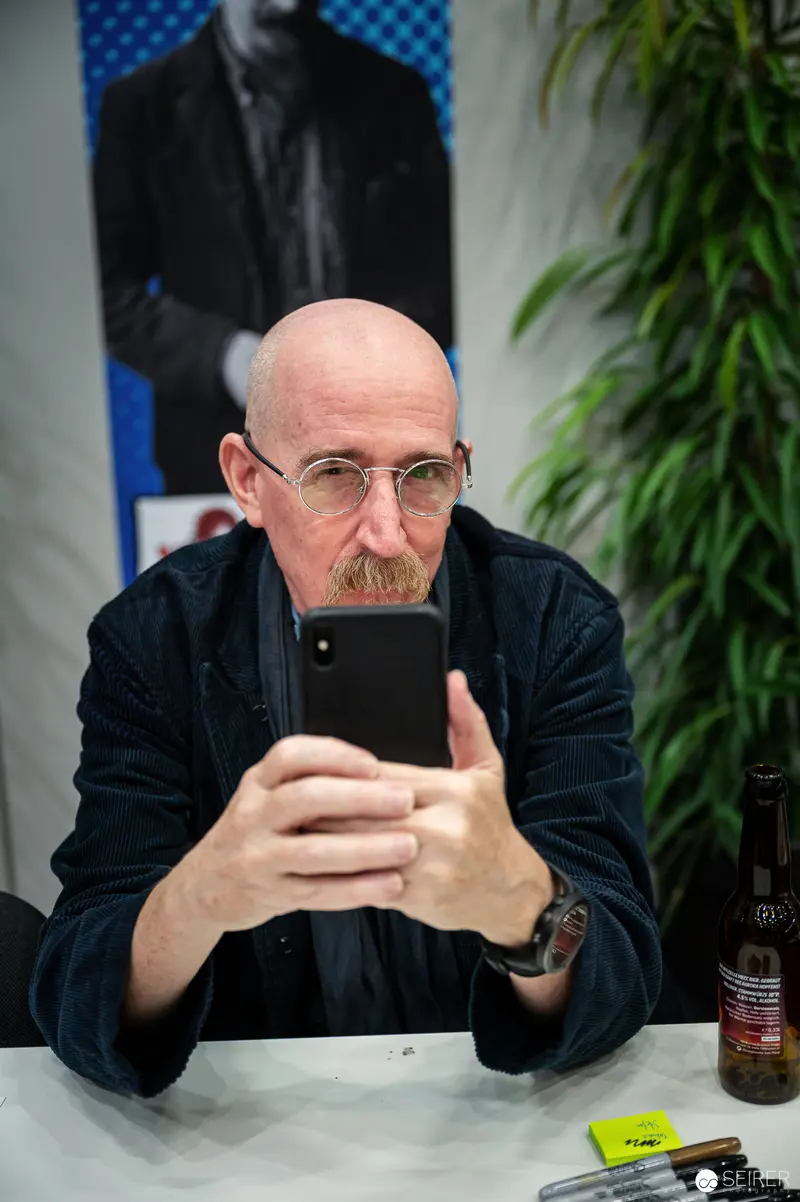 Bald Man Intently Photographing Himself at Vienna ComicCon 2022