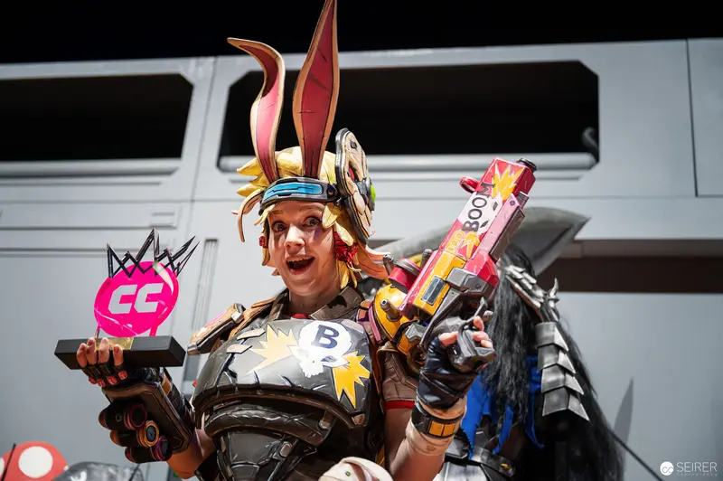 Elaborate Cosplay Warrior at Vienna ComicCon with Colorful Weaponry and Rabbit Ears