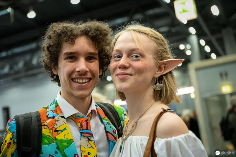 Comic Con Cosplay Pair in Vibrant Pokémon Vest and Elf Ears