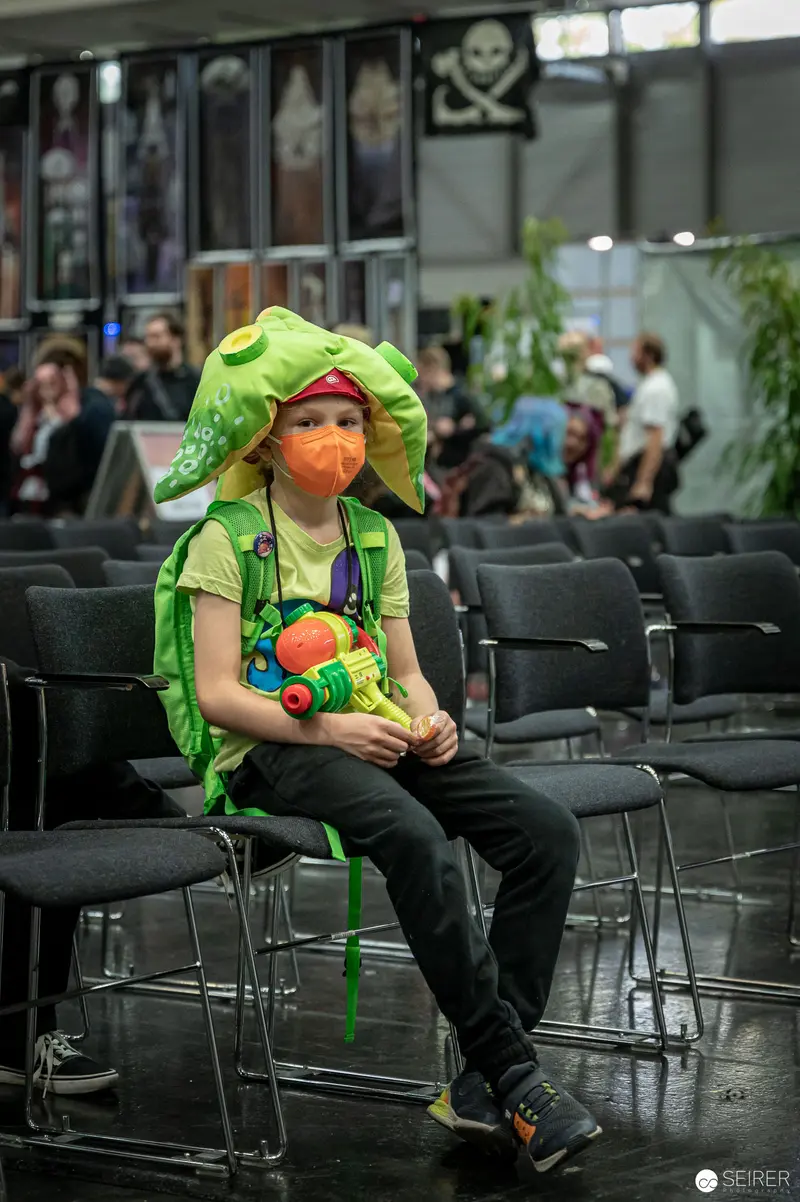 Cosplayer in Frog Costume Sits Alone at Vienna ComicCon 2022