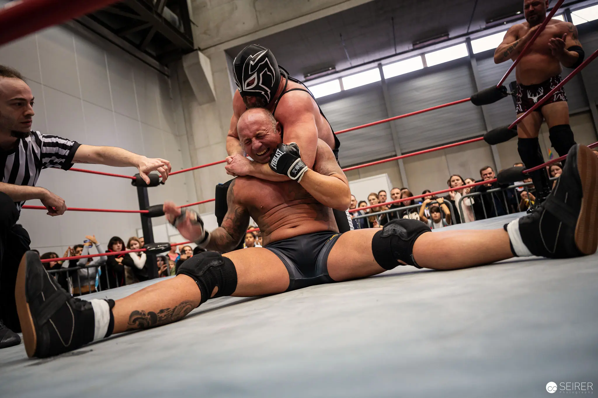 Masked Wrestler Applying Submission Hold at Watschclub Performance, VIECC 2022