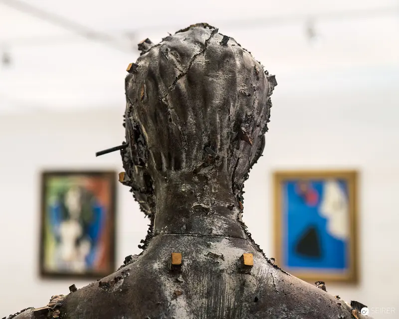 Textured Sculptural Bust Viewed from Rear in Gallery Exhibition Space