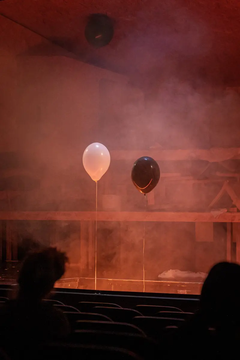 Theatrical Balloons in Misty Stage Atmosphere from Brecht's Performance
