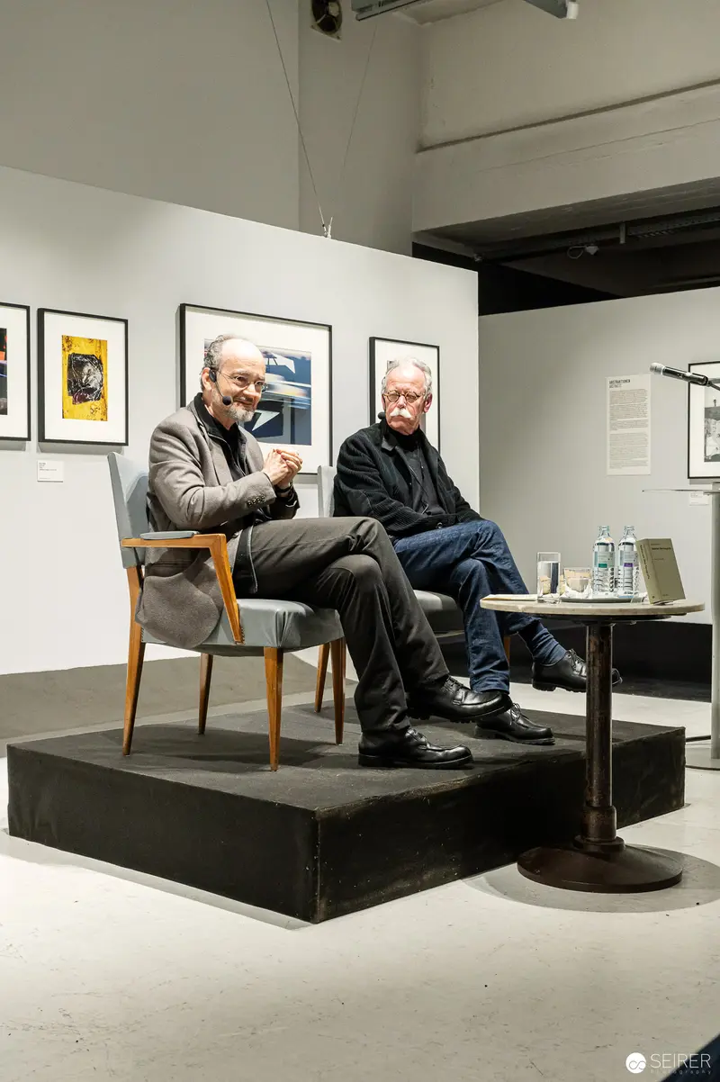 Hans-Michael Koetzle and Colleague Discuss Photography at Gallery Event