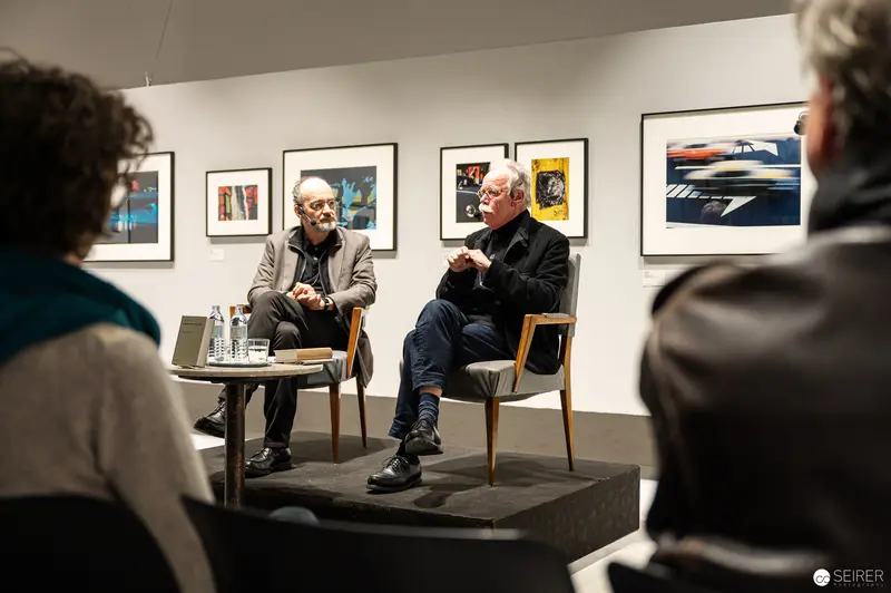 Hans-Michael Koetzle and Colleague Discuss Photography at Westlicht Gallery Exhibition