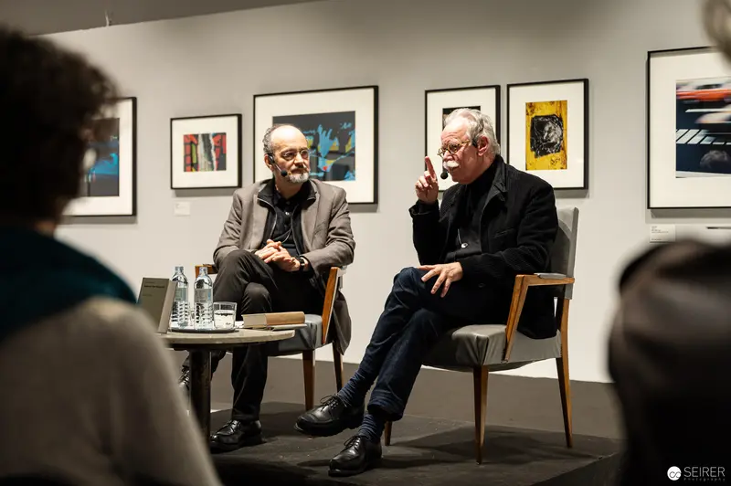 Hans-Michael Koetzle and Colleague Discuss Photography at Gallery Exhibition