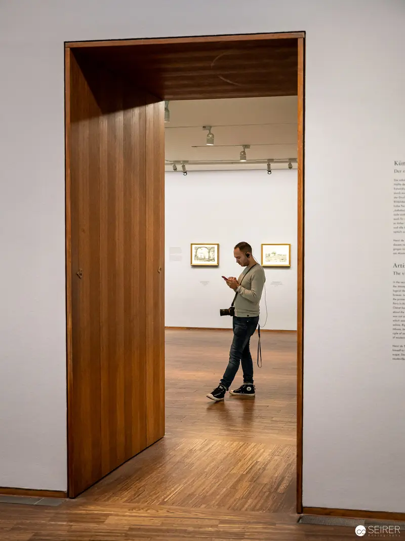 Solitary Viewer Exploring Gallery Space at Albertina's Master Printmaking Exhibition