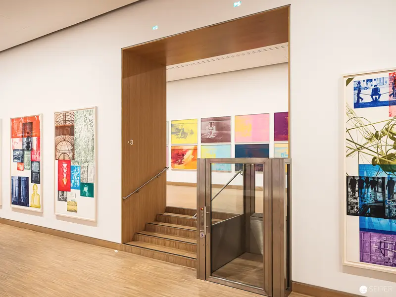Albertina Modern Exhibition Interior with Colorful Print Collection and Wooden Staircase