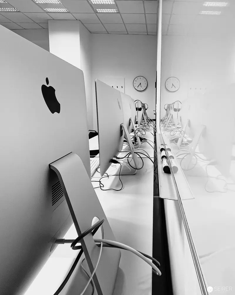 Apple Workspace at Webster University Vienna: Monochrome Technology Landscape
