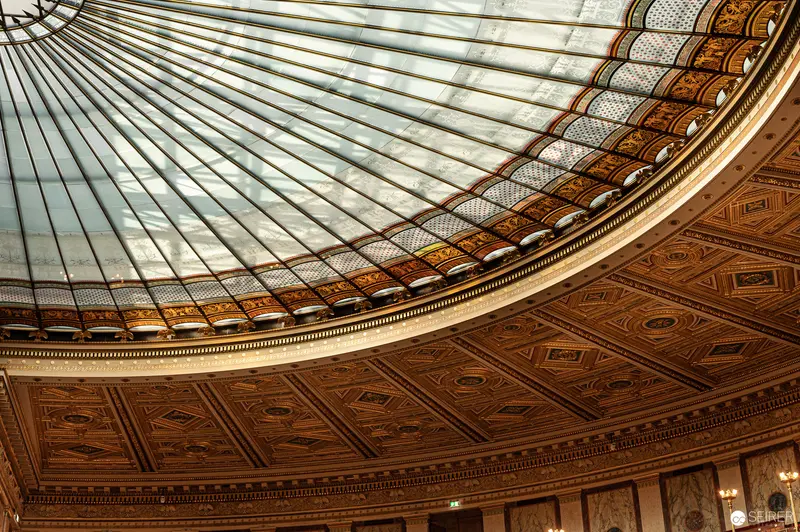 Ornate Glass Dome Ceiling at Vienna Parliament Building Revealing Architectural Grandeur