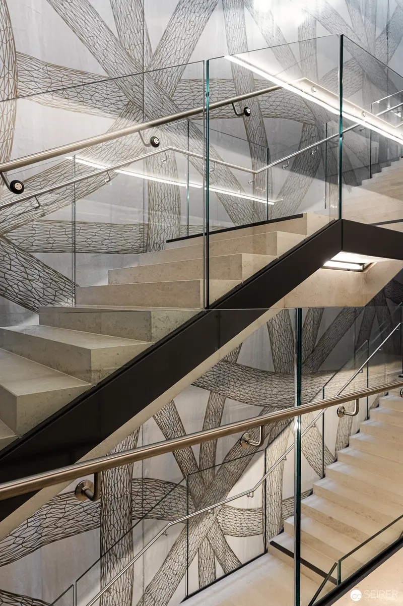 Peter Kogler's Architectural Intervention: Glass and Stone Staircase in Vienna Parliament