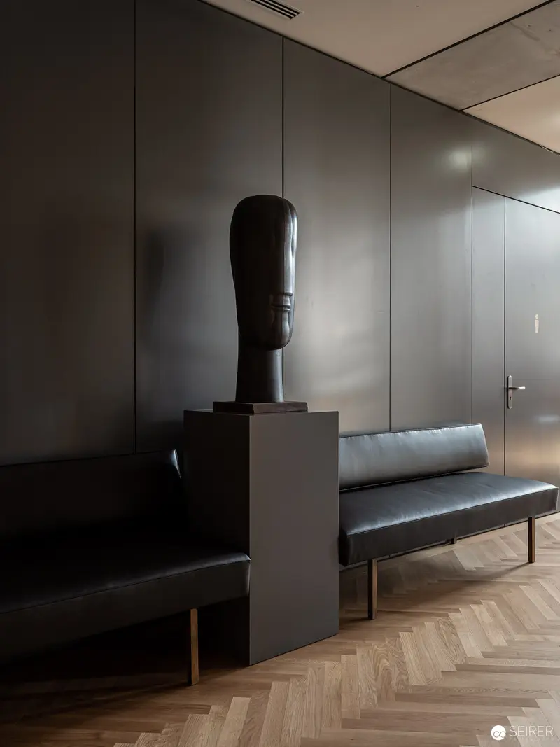 Minimalist Interior with Sculptural Bust and Leather Bench in Herringbone Space