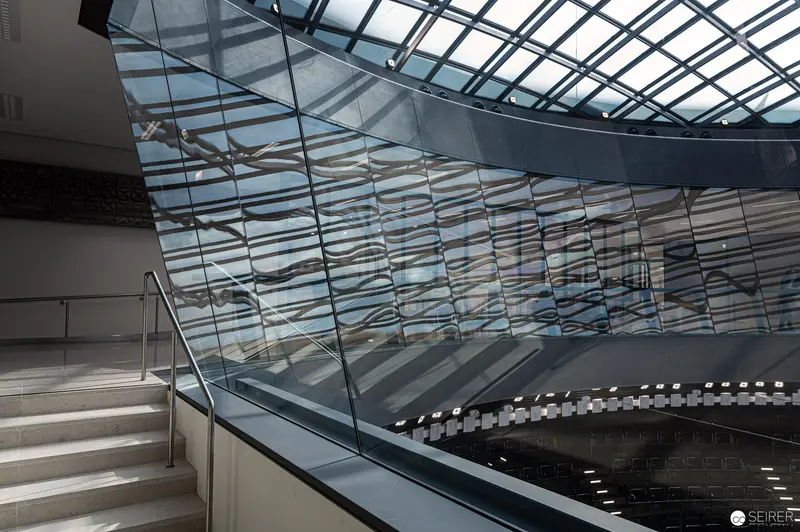 Geometric Reflections in Vienna Parliament's Modern Glass Architectural Interior