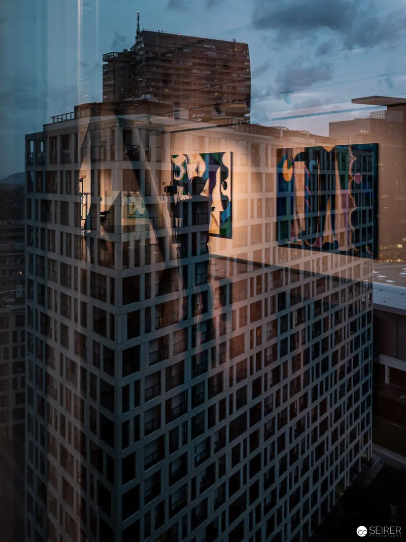 Twilight Reflections on Urban Architecture: Geometric Surfaces and Luminous Facades