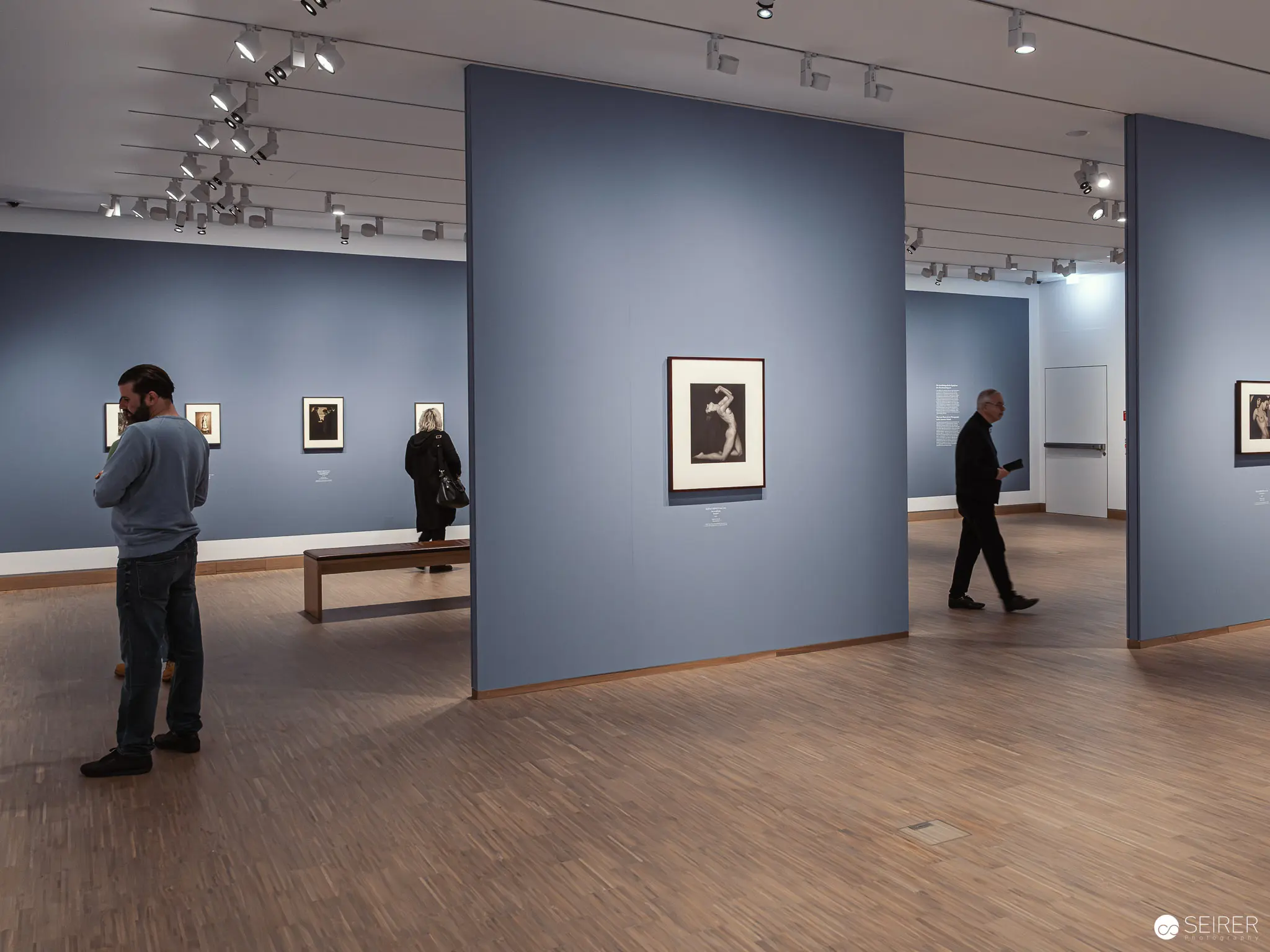 Visitors Contemplating Photographs at Albertina Modern's Piktorialismus Exhibition