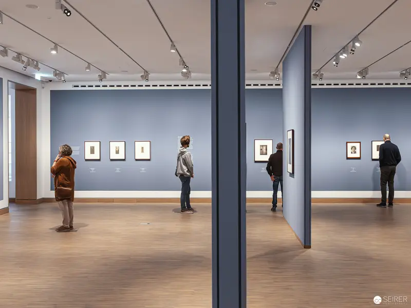 Visitors Contemplating Photographs in Albertina Modern's Piktorialismus Exhibition