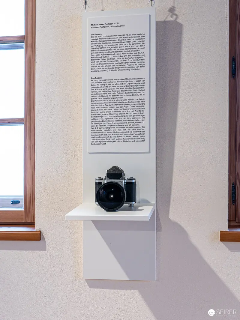 Vintage Camera on Minimalist Gallery Shelf during "17 Sisters" Exhibition
